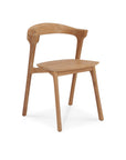 The Bok Outdoor Dining Chair by Ethnicraft is a modern FSC-certified teak chair with a curved backrest, angled arms, four legs, and a natural wood finish—part of the minimalist Ethnicraft outdoor collection.