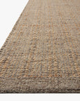 Close-up of the Cornwall Rug - Mocha / Natural by Loloi, showing its jute and wool blend with a textured grid pattern in beige and light brown, offering a natural look against a plain white background.