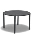 The Cove Dining Table | Black Oak by Wooden Stories features a round design with four straight legs, crafted from solid American oak. Shown on a white background with a soft shadow underneath.