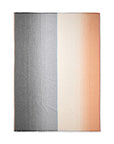 The Carte Postale Throw - Grey by Elvang Denmark is a rectangular alpaca wool blanket featuring a gradient design: gray with thin dark lines on the left, cream to light brown to orange on the right, separated by a subtle blue vertical line.