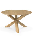 The Circle Dining Table - Oak by Ethnicraft features a round European oak top with a smooth surface and a unique X-shaped base, all set against a plain white background—showcasing the brand’s signature elegance.