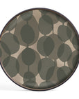 The Ethnicraft Connected Dots Glass Tray – Round / Small features organic forms with abstract olive green leaves on a muted beige background, finished with a dark brown rim.