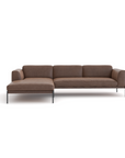 The Department Modular Sofa | Leather • M2 by Wooden Stories features plush cushions and slim metal legs in a brown L-shaped design, inspired by Danish collections and set against a white background.