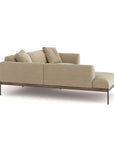 The Wooden Stories Department Modular Sofa | Fabric • M5 Left is a beige modern sectional with sleek metal legs, two seat cushions, four matching throw pillows, and a left chaise lounge, shown from the back at an angle on a white background.