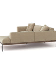 The Wooden Stories Department Modular Sofa | Fabric • M5 Right is a modern beige sectional with a chaise lounge, metal legs, FSC-certified oak accents, and three matching cushions, shown against a white background.