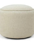 The Ethnicraft Donut Outdoor Pouf - Natural is a round, light beige pouf with a textured surface and minimalist design, displayed against a plain white background.