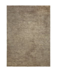 The Dunes Rug - Cumin by Ethnicraft is a rectangular, beige shaggy area rug with a soft, plush texture and subtle shading variations, shown on a white background.