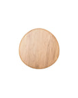 The Eden Side Table by Wooden Stories features a round, light solid wood design with smooth surface and natural American oak grain, showcasing Scandinavian simplicity against a plain white background.