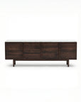 The Wooden Stories Yorke Sideboard with Stone Top features Danish-inspired lines, four paneled cabinet doors, dark wood finish, a white stone top, and short legs, shown against a plain white background.