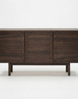 The Yorke Sideboard by Wooden Stories features a modern rectangular design with a dark walnut finish, three cabinet doors, clean Scandinavian-inspired lines, and four short legs. Shown against a plain white background.
