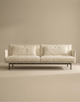 The Cherry Sofa | Fabric by SOBU is a modern, minimalist 3-seater with slim black metal legs and cream upholstery. Distinct Danish lines and two large seat/back cushions make it perfect for any contemporary living space.