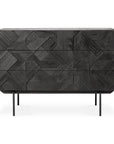 The Ethnicraft Graphic Dresser is a modern black wooden piece with three drawers, a graphic-textured front, and slim black metal legs.