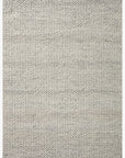 The Hendrick Rug - Ivory by Loloi is a rectangular wool area rug with a chunky, tightly woven texture, subtle uniform pattern, and natural shade variations for a handcrafted look.