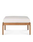 The Ethnicraft Jack Outdoor Footstool features a minimalist, modern rectangular teak frame with four legs and a thick off-white cushion—ideal for outdoor lounge chair settings.