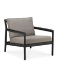 The Jack Outdoor Lounge Chair by Ethnicraft features a black teak frame with mocha cushions, shown against a white background.