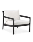 The Ethnicraft Jack Outdoor Lounge Chair features a black teak frame with an off-white cushioned seat and backrest, shown against a plain white background.