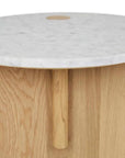 The Pivot Side Table | Light Oak by Wooden Stories features modern Danish design with a light solid oak base, a smooth white marble top, and a small circular wooden accent near the edge.