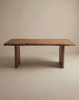 The SOBU Leviathan Live Edge Dining Table features a solid acacia top with a natural finish, thick wood legs, and a smooth, slightly irregular surface, shown against a plain beige background.