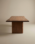 The SOBU Leviathan Live Edge Dining Table features a thick, natural live edge acacia top and sturdy wood legs, showcased against a plain beige background.