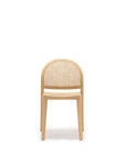 The Wooden Stories Luk Dining Chair features a light wood frame, rounded backrest, and elegant cane weave rattan seat and back, photographed on a plain white background—ideal for contract grade spaces.