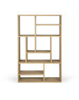 The M Rack Short - Oak by Ethnicraft is a Mondrian-inspired wooden bookshelf with an open, asymmetrical design and multiple rectangular compartments, crafted from solid oak and shown against a plain white background.