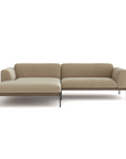 The Wooden Stories Department Modular Sofa | Fabric • M3 features a modern beige design with a left-hand chaise, thin black metal legs, and a minimalist FSC-certified oak base, shown against a plain white background.