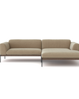 The Department Modular Sofa | Fabric • M3 by Wooden Stories is a modern beige L-shaped sofa with slim metal legs and low armrests, inspired by Danish collections to complement contemporary interiors. Isolated on a white background.