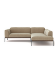 The Wooden Stories Department Modular Sofa | Fabric • M5 is a modern beige L-shaped sectional with thin black metal legs, a minimalist design, and an FSC-certified oak base, shown against a plain white background.