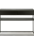 The Monolit Console - Black Oak by Ethnicraft is a modern, minimalist console with two drawers, an open shelf, and a sturdy metal frame. Made from contract grade materials, it features clean lines, a matte finish, and contemporary design.