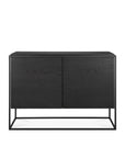 The Ethnicraft Monolit Sideboard - 2 door is a modern black wooden piece made from solid European oak, featuring two doors, a minimalist design, and a rectangular black metal frame base, shown against a plain white background.