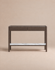 The Nell Console by Wooden Stories showcases Scandinavian-inspired design with its modern silhouette in espresso oak, featuring solid oak construction, two drawers, and a white stone lower shelf, presented against a plain beige background.