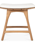 The Ethnicraft Osso Outdoor Stool with cushion features a light brown teak frame, curved legs, and a white seat. This modern stool is part of Ethnicraft’s outdoor collection and is photographed against a plain white background.