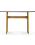 The PI Console - Oak by Ethnicraft is a minimalist wooden table featuring a smooth, rounded rectangular solid oak top, two narrow vertical legs, and a lower shelf in a light natural finish, set against a white background.