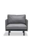 Front view of the Wooden Stories Pensive Lounge Chair | Leather, showcasing sleek Danish lines, leather upholstery, and black legs, set against a plain white background.