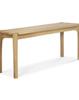 The Ethnicraft Pi Bench - Oak features a minimalist design with rounded edges and four sturdy legs, crafted from solid oak, shown on a white background.