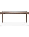 The Ethnicraft Pi Dining Table - Teak Brown features a minimalist, modern design with four rounded legs and a smooth surface, crafted from FSC-certified teak. Its elegant look stands out against a plain white background.