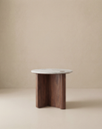 The Pivot Side Table | Wood & Stone by Wooden Stories features a white marble top and solid oak three-paneled base, shown here against a plain beige background.