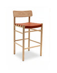 The SOBU Cesco Counter Stool features a solid white ash frame, a rectangular backrest, and a flat seat upholstered in burnt orange top grain leather, shown against a plain white background.