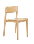 The Poise Dining Chair | Light Oak by Wooden Stories offers a simple, modern design with a gently curved backrest and seat, straight legs, and a natural finish. This contract-grade chair blends style and durability for any dining space.