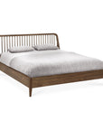 The Spindle Bed - Teak by Ethnicraft, crafted from reclaimed FSC-certified teak, features a slatted headboard and is shown with light gray bedding and matching pillows against a white background.