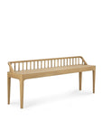The Ethnicraft Spindle Bench - Oak features solid European oak, a slatted spindle backrest, light wood finish, and four tapered legs, as shown against a plain white background.