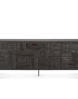 The Ethnicraft Tabwa Sideboard - 4 door features dark wood with intricate Tabwa-inspired geometric motifs, multiple doors, and slender black metal legs.