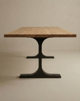 The SOBU Tommaso Dining Table features a modern European oak rectangular top and two black metal T-legs, displayed against a simple light backdrop.