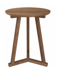 The Ethnicraft Tripod Side Table - Teak is a small, round table with a modern design. Made from teak wood with a natural medium-brown finish, it features quality craftsmanship and three angled legs for sturdy support.