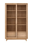 The Wave Storage Cupboard by Ethnicraft features European oak in a light finish, two sliding glass doors, four spacious shelves, and two bottom drawers.