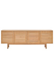 The Yorke Sideboard by Wooden Stories is crafted from solid oak with four doors, short legs, and a minimalist Scandinavian design, shown against a plain white background.