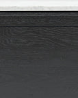 A close-up of the Wooden Stories Yorke Sideboard with Stone Top shows its black wooden cabinet door featuring Danish lines and visible wood grain, paired with a white stone top.
