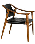 The Garibaldi Chair by Noir Trading Inc. is a modern teak chair with a wooden frame, black padded leather seat and backrest, curved armrests, and a minimalist mid-century modern design.