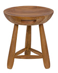 The Basel Stool/Side Table by Noir Trading Inc. is a handcrafted teak tripod piece featuring a round, concave seat, three angled legs, and a triangular support. Its smooth natural wood finish enhances its timeless look.