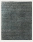 The Agra Rug - Marlin by Armadillo&Co is a rectangular, flat-woven rug in muted gray and blue tones, crafted from abrash-dyed wool for subtle texture with no visible pattern.